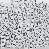 BD00123-02-black-letter-white-opaque-cube-alphabet-beads-single-l-7mm